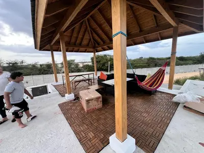 a pavilion with a hammock and a person walking at The Ocean Romana in La Romana