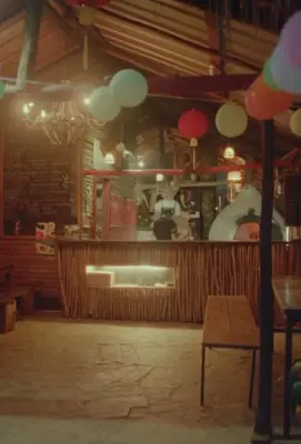 a restaurant with a bar with a man in the background at Casa Caona in El Valle