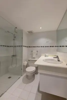 a bathroom with a toilet and a shower and a sink at Viva Heavens by Wyndham, A Trademark All Inclusive in San Felipe de Puerto Plata