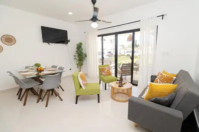 a living room with a couch and a table at Cozy 1-BR Apartment in Sunshine Bayahibe in San Rafael del Yuma