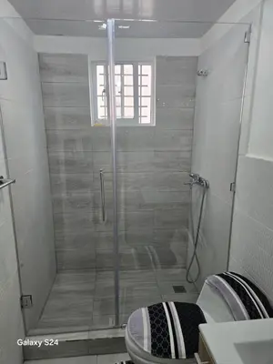 a bathroom with a shower and a toilet in it at Peace Place in Santiago de los Caballeros
