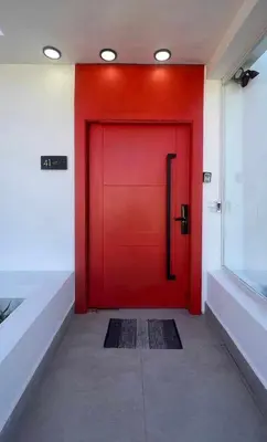 a red door in a building with a red at Unique 3 Bedrooms Villa las Palmas 41 in Puerto Plata