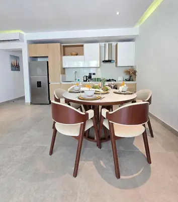 a kitchen and dining room with a table and chairs at Margarita 102 Private Beach Access Aqua Esmeralda Dominicus in La Laguna