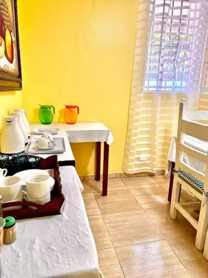 a kitchen with a table with a tray of dishes at Beautiful Caribbean Coast Residence in Santo Domingo
