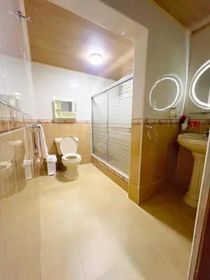 a bathroom with a toilet and a sink and a shower at Beautiful Caribbean Coast Residence in Santo Domingo
