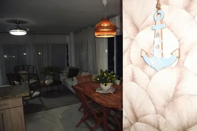 a kitchen and a living room with a table at Experience Coconut Paradise Apart O2 in San Cristóbal