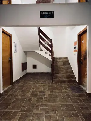 an empty hallway with a staircase in a building at Experience Coconut Paradise Apart O2 in San Cristóbal