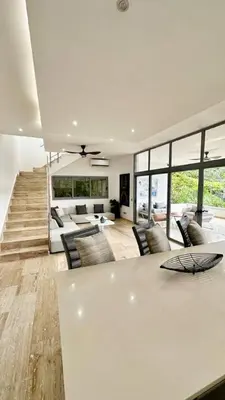 a living room with a white table and chairs at Casa Las Ballenas - 3 bedroom Las Terrenas in Las Terrenas