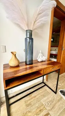 a table with a vase and feathers on it at Casa Las Ballenas - 3 bedroom Las Terrenas in Las Terrenas