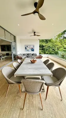 a dining room with a white table and chairs at Casa Las Ballenas - 3 bedroom Las Terrenas in Las Terrenas