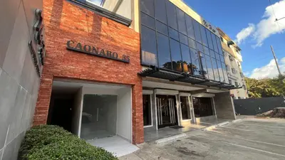 a red brick building with a sign on it at Caonabo35 Elegancia Boutique en Santo Domingo 6 in Santo Domingo