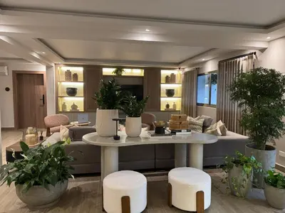 a living room with a couch and a table and stools at Caonabo35 Elegancia Boutique en Santo Domingo 7 in Santo Domingo