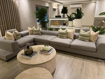 a living room with a couch and a table at Caonabo35 Elegancia Boutique en Santo Domingo 8 in Santo Domingo