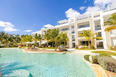 a large swimming pool in front of a building at Dominica 203 Luxury Apartment by Caribbean Beach Dominicus Aqua Esmeralda in Bayahibe