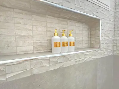 three bottles of soap sitting on a shelf in a bathroom at Dominica 203 Luxury Apartment by Caribbean Beach Dominicus Aqua Esmeralda in Bayahibe