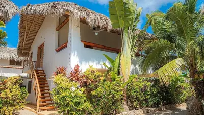 a house with a palm tree in front of it at Guest-Room 2 Palmeras - 2 Pax, 5 Min de La Playa in Las Galeras