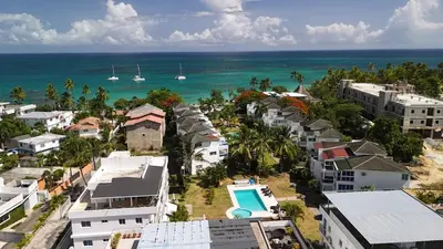 an aerial view of a city with houses and the ocean at La Fenice 3 Bedroom Beachfront Apartment in Las Terrenas