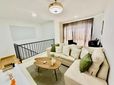a living room with a couch and a table at Apartment 3 rooms terrace Wi-Fi Distrito Naciona in Pantoja