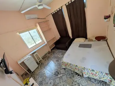 an overhead view of a bedroom with a bed and a window at Casa de huéspedes El Español in Santo Domingo