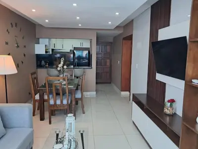 a living room with a couch and a dining room at Torre san geronimo 1109 apartamento 10-06 in Santo Domingo