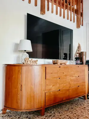 a large wooden dresser with a lamp on top of it at Lux Villa Casa de Campo in La Romana