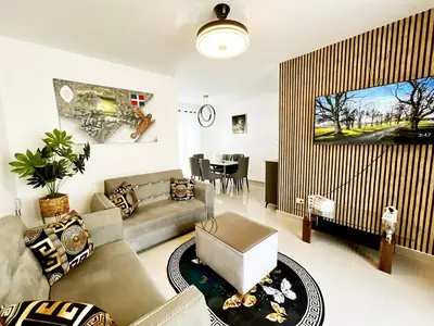 a living room with a couch and a table at Ideal space for the family in Boca Chica