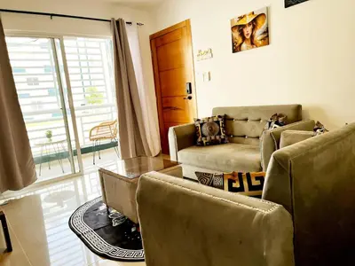 a living room with two chairs and a couch at Ideal space for the family in Boca Chica
