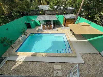 an overhead view of a swimming pool in a resort at Villa yaya 1 in Boca Chica