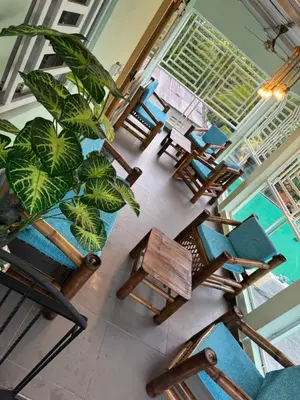 an overhead view of a dining room with chairs and a plant at Villa yaya 1 in Boca Chica