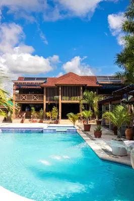 a large swimming pool in front of a house at Blue Lagoon House RD