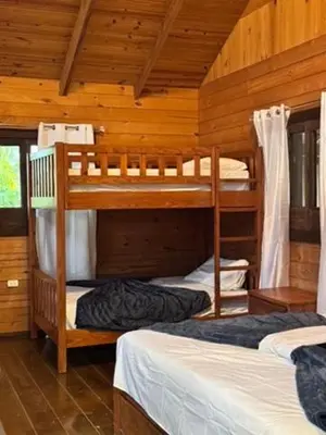 a bedroom with two bunk beds in a cabin at Blue Lagoon House RD