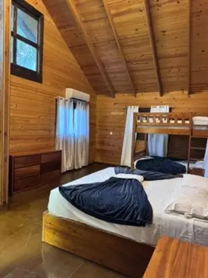 a bedroom with two bunk beds in a cabin at Blue Lagoon House RD
