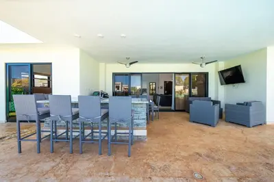 a living room with a table and chairs at Peace Design Exclusivity in Sosúa