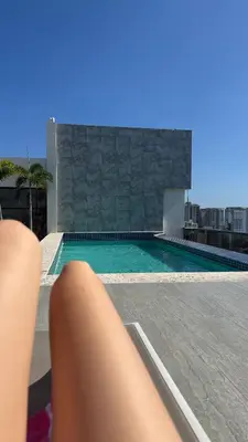 a swimming pool on the roof of a building at Sirius apartment in Santo Domingo