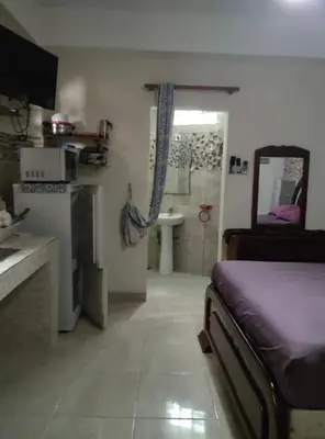 a bedroom with a bed and a bathroom with a shower at Apart-Hotel Costa Verde in Costa Verde