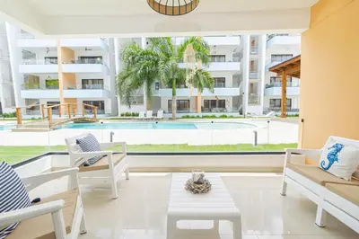 a view of the pool from the living room of a apartment at Chic Bayahibe 2BR in Sunshine near Bayahibe Center in Bayahibe