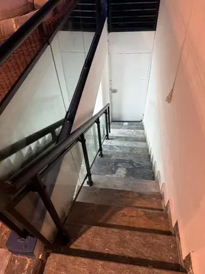 a stairway leading up to a white door at private property just for you in San Isidro