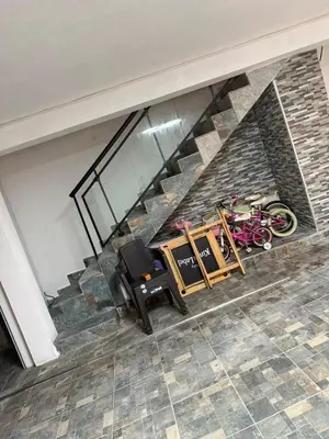 an overhead view of a staircase with a chair and bikes at private property just for you in San Isidro