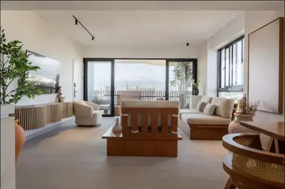 a living room with a couch and a table at Casita Coco - Luxury Apartment in Santiago in Santiago de los Caballeros