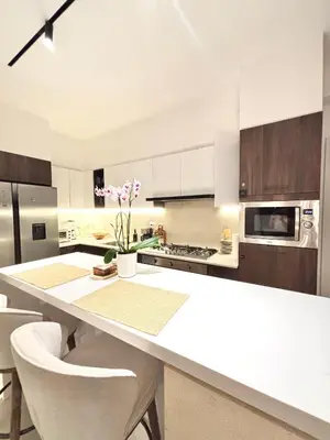 a kitchen with white cabinets and a white counter top at Casita Coco - Luxury Apartment in Santiago in Santiago de los Caballeros