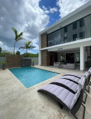 a villa with a swimming pool and a house at Residenza in Santiago de los Caballeros