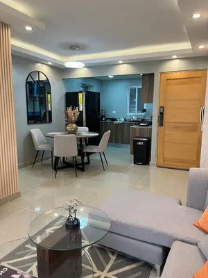 a living room with a couch and a table at Moderno Apartamento Boca Chica, 5 minutos del Aeropuerto in La Caleta