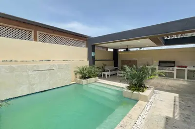 a swimming pool in the backyard of a house at Elegante Casa Estrella Marina 117 Pool BBQ in La Romana