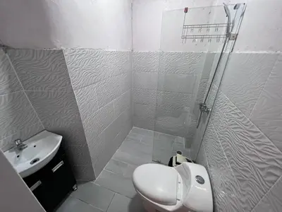 a bathroom with a shower and a toilet and a sink at Villa las Terrazas in Cabayona
