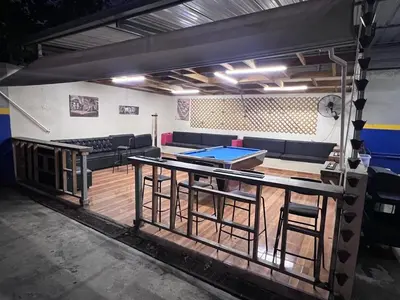 a ping pong table in a room with a ping pong table at Villa las Terrazas in Cabayona