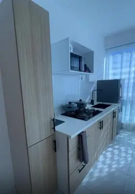 a kitchen with a stove and a counter top at Mar, Sol y Arena in Paraíso