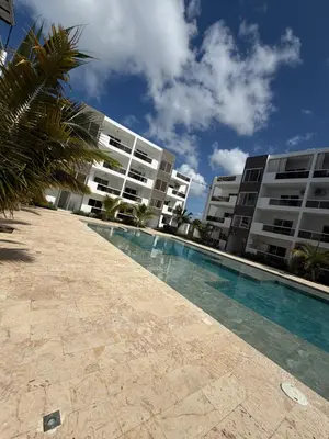 a swimming pool in front of a building at Luxury NEW Stylish apartment Bayahibe with pool in Bayahibe