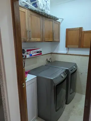 a small kitchen with a washing machine in it at Hispanola Beach 3 Bdr Outdoor Jacuzzi in Sosúa