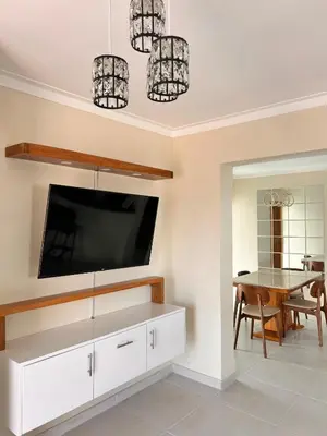 a dining room with a tv and a table at Vista del sol in La Viva