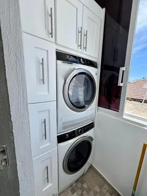 a washer and dryer sitting in a garage at Bayahibe Apartment by the Beach in Bayahibe